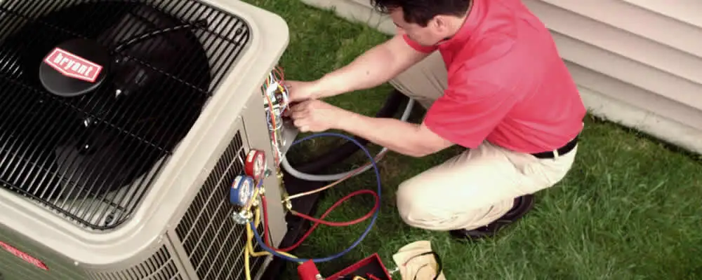 HVAC technician servicing an outdoor air conditioner unit in Santa Rosa, CA