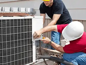 HVAC technicians repairing an outdoor AC unit on a rooftop in Santa Rosa, CA