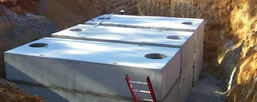 Septic tank installation site with a newly placed concrete tank in Santa Rosa, CA